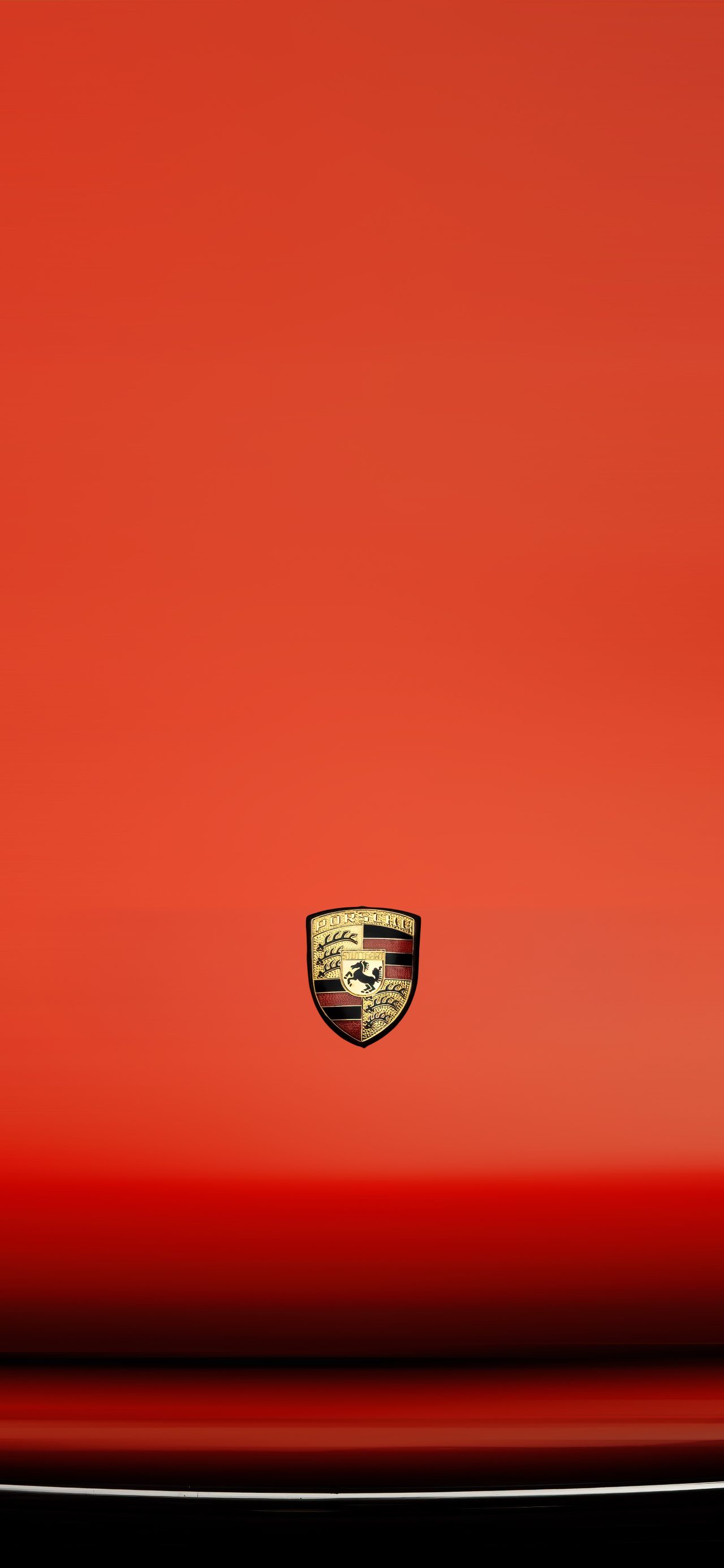 Porsche Emblem on a Red Hood 4K Phone Wallpaper
