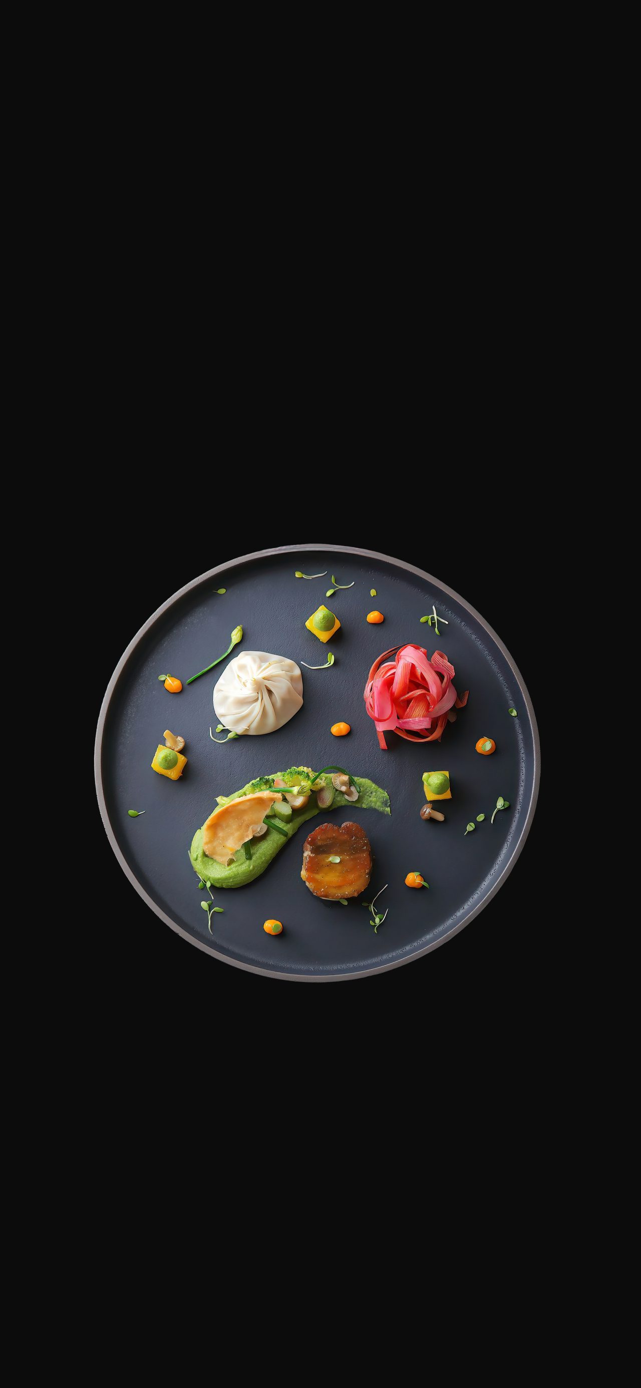 Japanese food on a black ceramic plate 4k phone wallpaper
